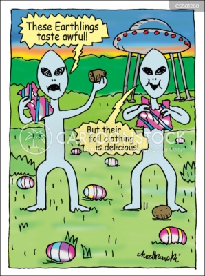 Cartoon of two space aliens on earth at Easter. Their space ship is parked behind them. They think the foil-covered Easter eggs they’ve found are earthlings and are eating them. But they’ve thrown the chocolate to the ground and are eating the foil. One remarks that the earthlings taste awful. The other agrees but notes their clothes are delicious. Perfect companions for chocolate lovers.
